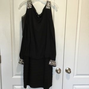 Long sleeve black dress with peek a boo shoulder